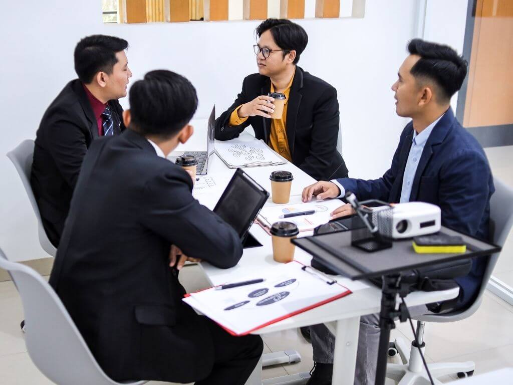 a group of businessmen engaged in a meeting