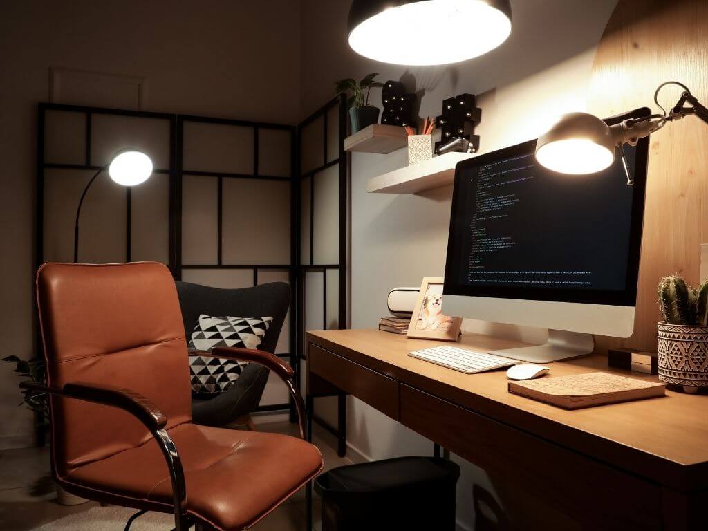 a home office setup with ergonomic chair and table