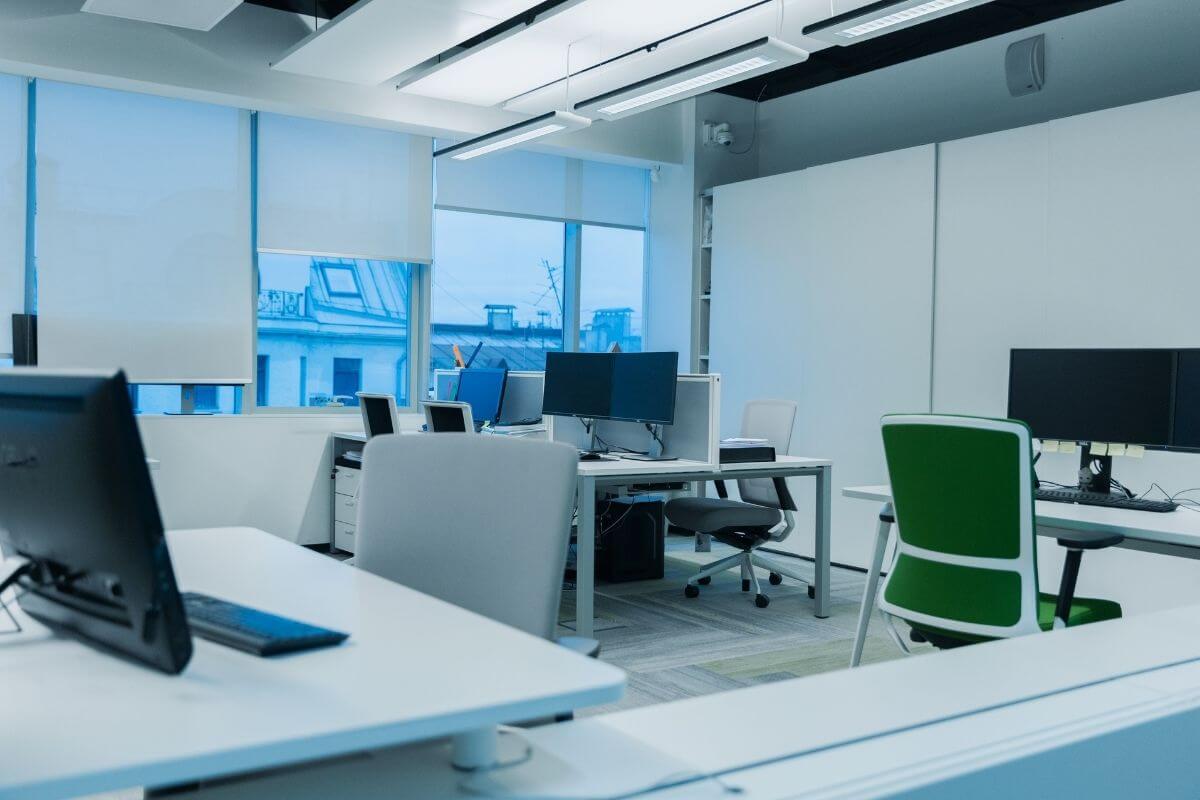 a modern workplace with ergonomic office chairs and tables